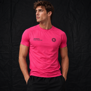 Front view of a male model wearing a hot pink short-sleeve athletic t-shirt with TRAINING MADE YOUR DAY text and a swirl logo on the chest, paired with black shorts.