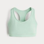 Mint green sports bra back view racerback design on white studio background