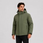 Men's 2-in-1 puffer jacket in olive green, three-quarter front view with outer jacket closed and zipped, hooded, model pose, full-zip soft shell