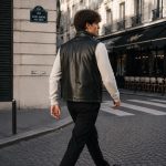 Men's black leather puffer vest model back view Paris street, clean rear construction