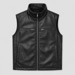 Men's black leather puffer vest flat lay front view product photo, full zip stand collar, twin chest zip pockets, side welt pockets