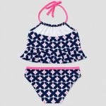 Back flat-lay navy geometric tankini with halter tie-back and pink waistband