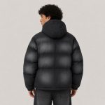 Men's distressed-wash puffer jacket in black - model back view