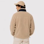 Men's sherpa fleece jacket in cream with navy blue contrast collar, chest zip pocket, twin zip hand pockets - model back view, OEM wholesale men's outerwear