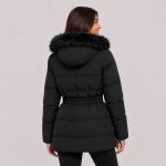 Women's puffer parka in black with faux fur trim hood, belted waist, mid-thigh length - model back view, OEM wholesale women's outerwear