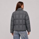 Women's cropped quilted puffer jacket in gray with stand collar, box-quilt channels, drawcord cinches - model back view, OEM wholesale women's outerwear