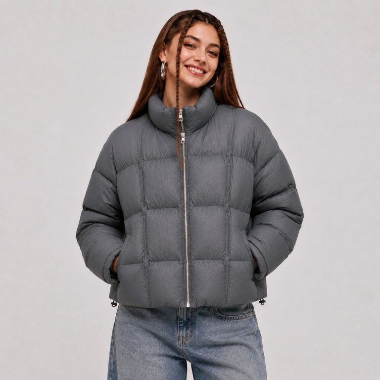 Women's cropped quilted puffer jacket in gray with stand collar, box-quilt channels, drawcord cinches - model front view, OEM wholesale women's outerwear