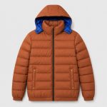 Men's quilted puffer jacket in rust/orange with blue lining - flat front view, OEM wholesale outerwear