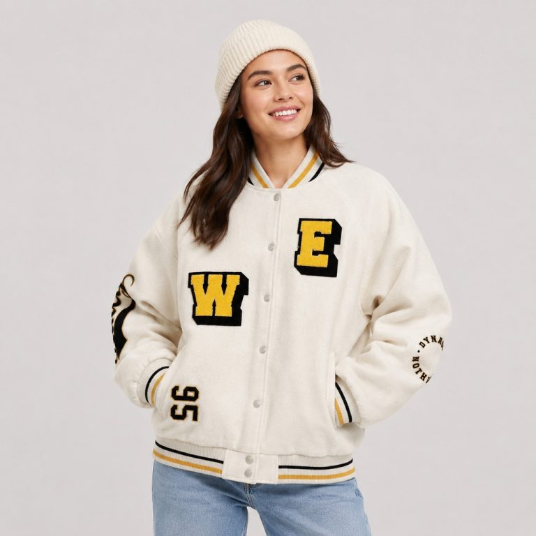 Women's varsity bomber jacket in cream wool blend with letter patches, snap-button front, ribbed trim - model front view, OEM wholesale women's outwear