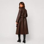 Women's long PU leather trench coat in chocolate brown - model walking pose side view (replacement), OEM wholesale women's outerwear