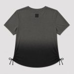 Women's athletic workout top in black ombre gradient (dark grey at neck fading to black at hem) with side drawstring ruching - flat front view, OEM wholesale women's activewear, sizes XS-XL