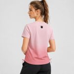 Women's athletic workout top in pink ombre gradient with side drawstring hem - model back view, OEM wholesale women's activewear, sizes XS-XL