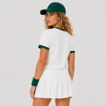 Women's athletic workout top in white with hunter green contrast ringer trim at neck and sleeve cuffs - model back view, OEM wholesale women's activewear