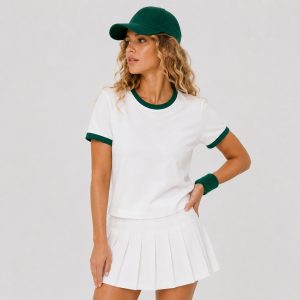 Women's athletic workout top in white with hunter green contrast ringer trim at neck and sleeve cuffs - model front view, OEM wholesale women's activewear
