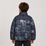 Boy's puffer jacket in navy with distressed letter graphic print - model back view, OEM wholesale kids outerwear