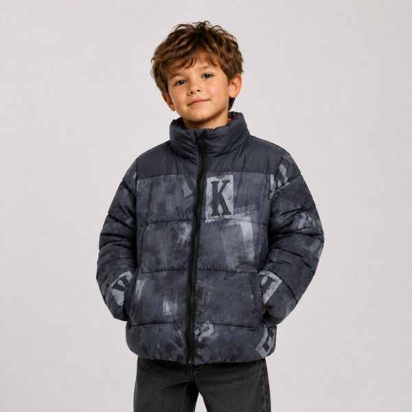 Boy's puffer jacket in navy with distressed letter graphic print - model front view, OEM wholesale kids outerwear