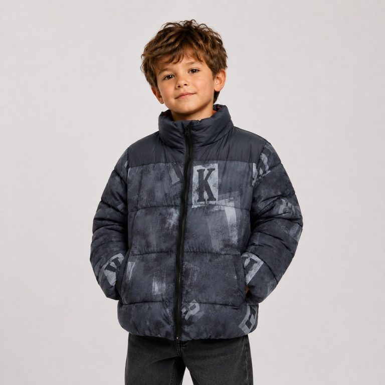Boy's puffer jacket in navy with distressed letter graphic print - model front view, OEM wholesale kids outerwear