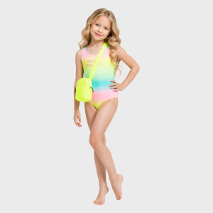 Young girl modeling a rainbow ombre one-piece swimsuit with neon yellow crossbody bag, front view against white background.