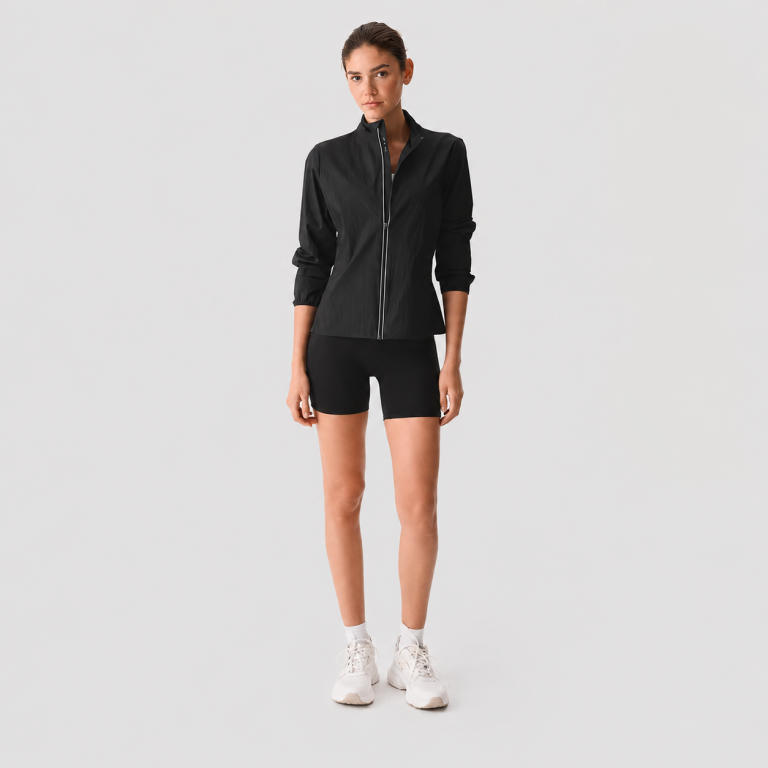 Women's black high-waisted biker workout shorts, front full body view, white sneakers
