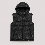 Boy's speckle quilted puffer vest in black and white with hooded zip-front and contrast stitching - flat front view, OEM wholesale kids outerwear