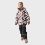 Young girl modeling a pink, white, and black abstract-print puffer jacket with hood, front pockets, and zipper, paired with black snow pants and tan winter boots in studio setting.