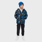 Child wearing a navy blue puffer jacket with colorful dinosaur print, paired with a royal blue beanie, black cargo joggers, and white velcro sneakers, front view.
