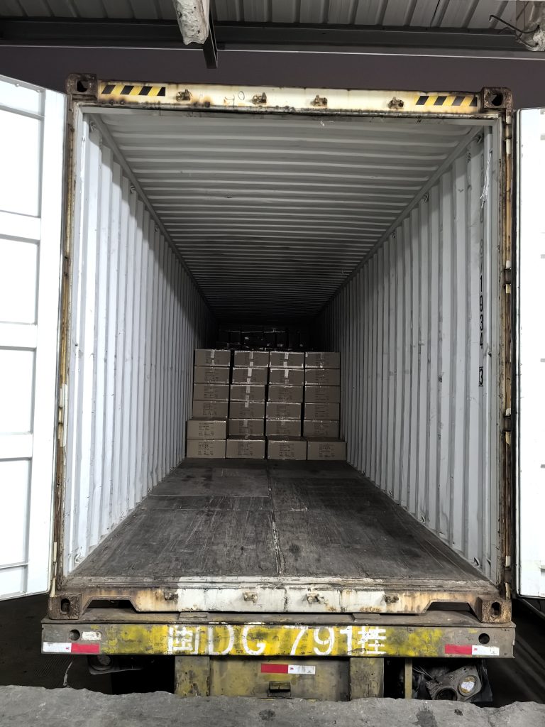 Bulk Apparel Production Completed and Ready for Overseas Shipment 3 Palletized cartons of finished bulk apparel stacked neatly inside a 40-foot shipping container at Quanzhou Northern Garment's Jinjiang facility, ready for sealing and overseas dispatch.