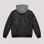 Boy's black faux leather (PU leather) bomber jacket back view, epaulettes on each shoulder with silver snap button, ribbed cuffs and hem in black ribbed knit, no text or logo on back, kid model back view with heather gray hooded sweatshirt hood up underneath, khaki cargo pants, white studio background